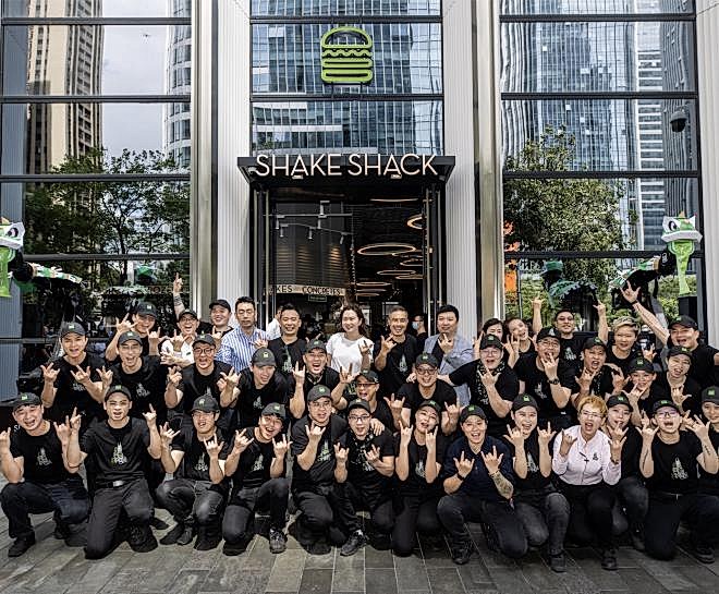 International team outside of Shake Shack